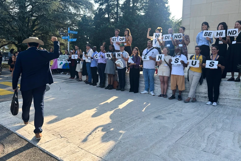 Environmentalists and Indigenous leaders protest plastic pollution outside the UN building in Geneva during UNEP-led INC-5.2 talks on production caps vs waste management